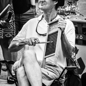 July 2018 • Duke Thompson plays the washboard in the Drum Circle