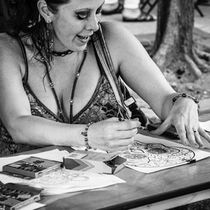Sept. 2018 • Belly dancer April Monique tries her hand at the kids coloring table